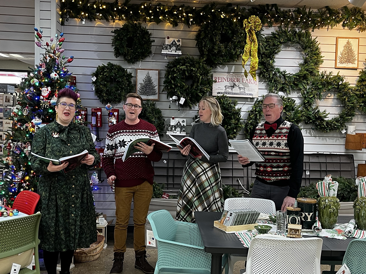 Four people singing carols in The Bruce Company (file photo)