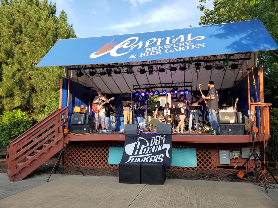 a group of people that are standing on a stage.