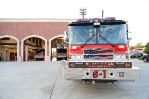 a fire truck parked in front of a fire station