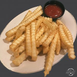 french fries with ketchup on a plate.