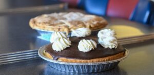 a couple of pies sitting on top of a table