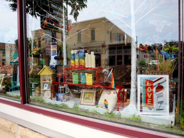 a store window with a bunch of items in it.