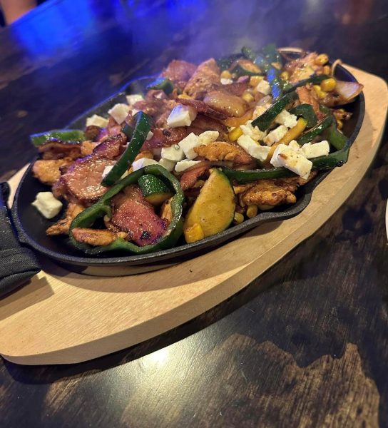 A skillet with a plate of food on it.